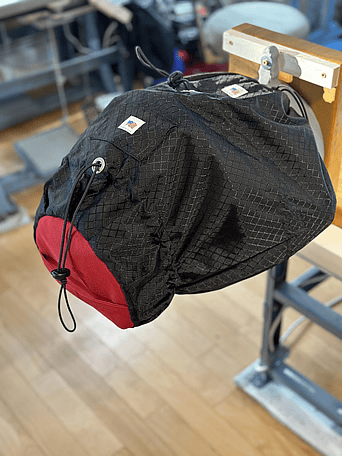 Black and red tire cover